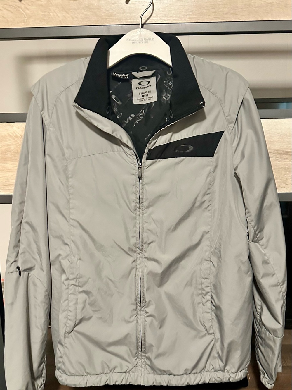 Oakley Light Gray Windbreaker with Black Chest Accent